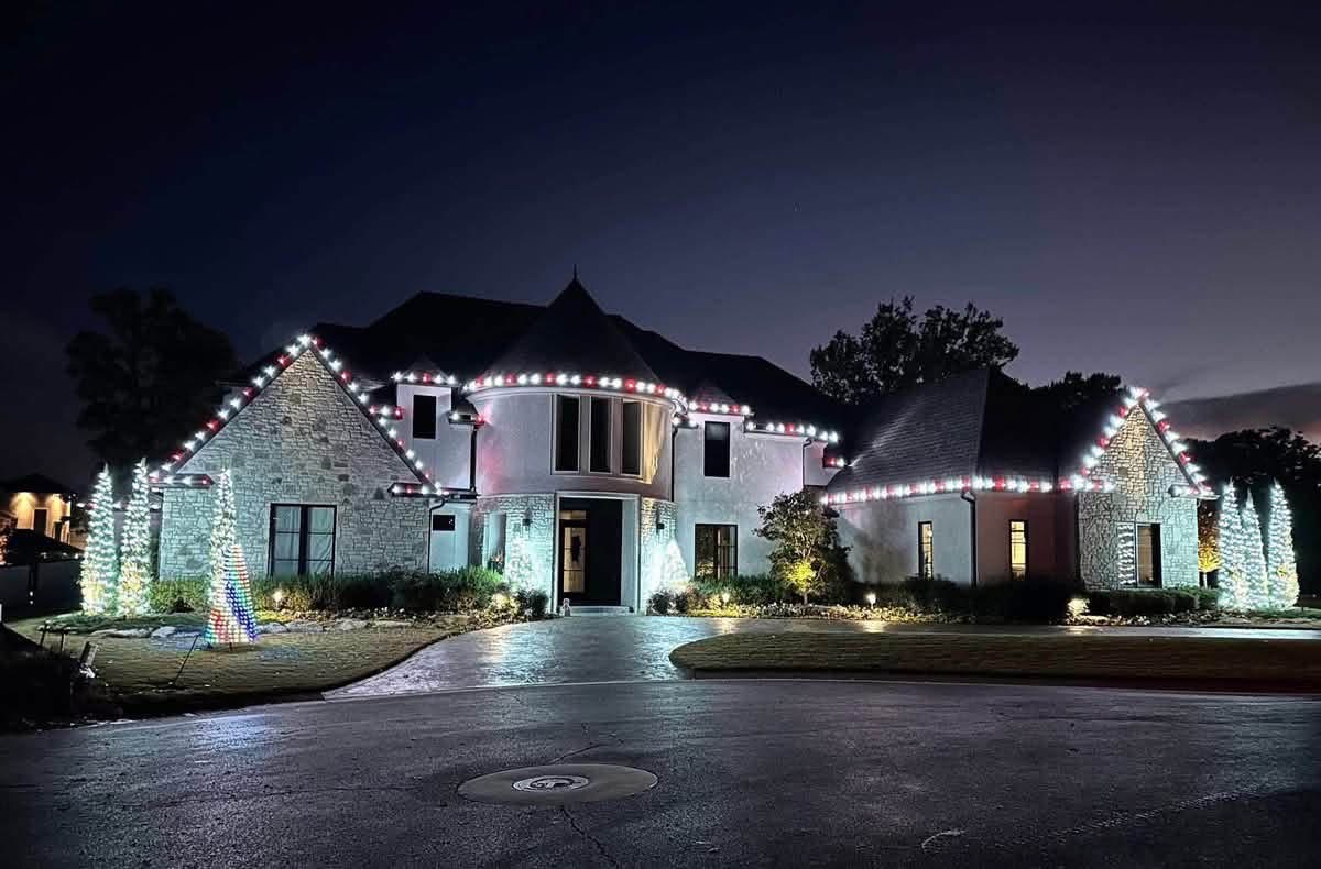 Large home with illuminated Christmas rooflines